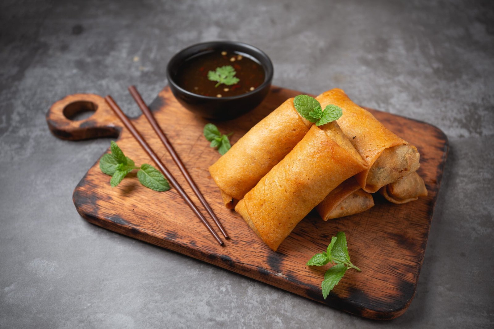 fried-spring-rolls-cutting-board (1)
